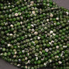 Close-up of green and white bead string on a gray background