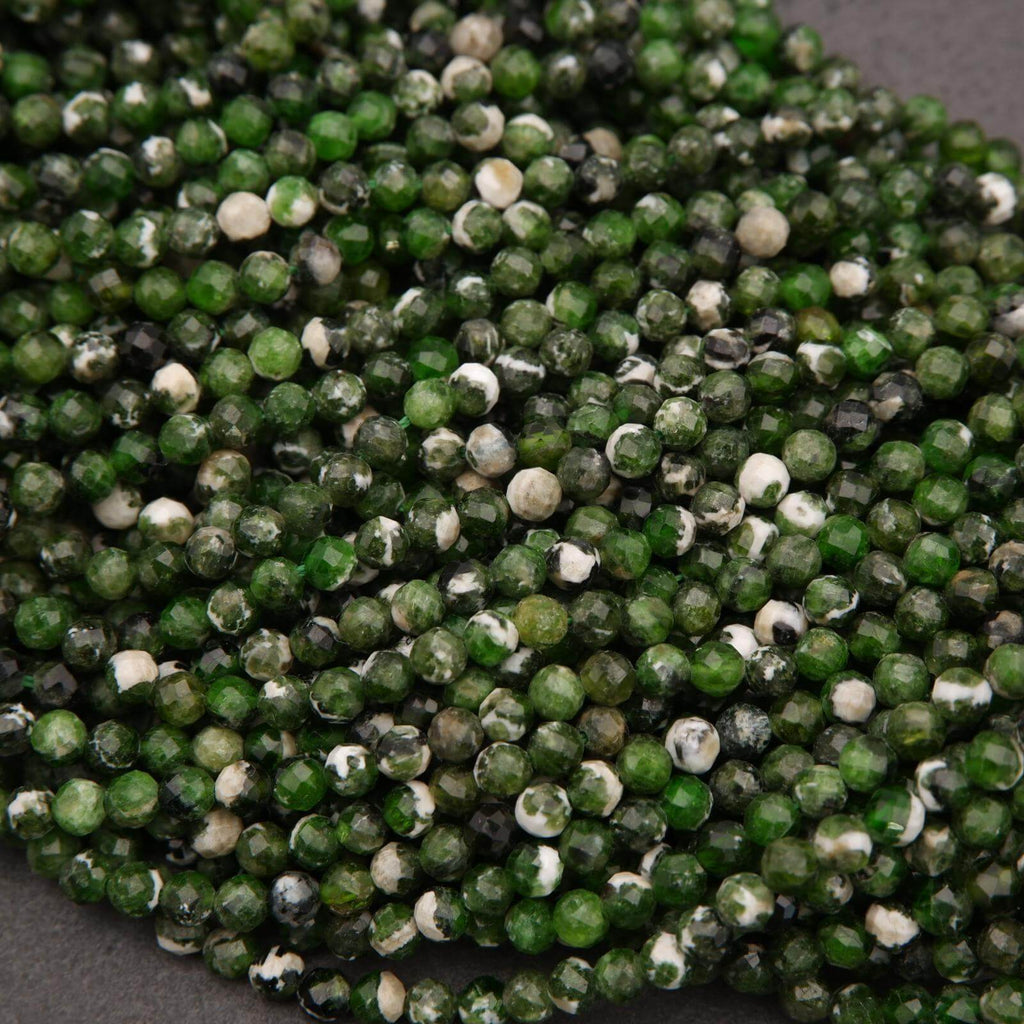 Close-up of green and white bead string on a gray background