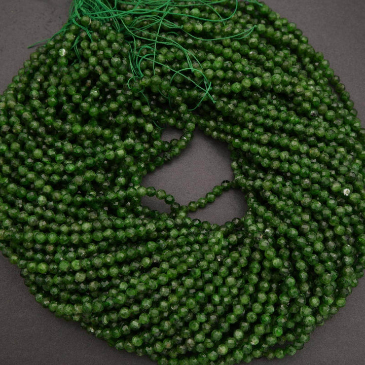 Green beaded string on a dark gray background