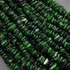 Close-up of green beads on a gray background