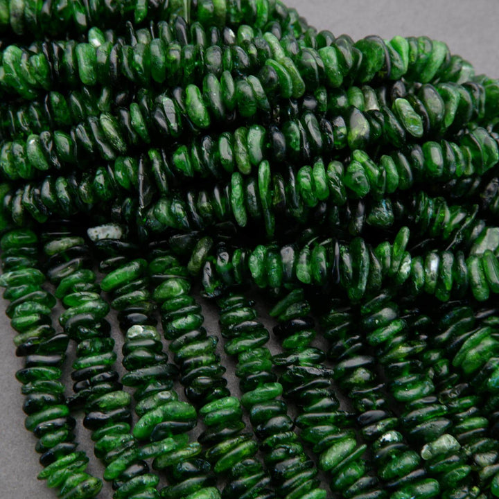 String of green beads on a gray background