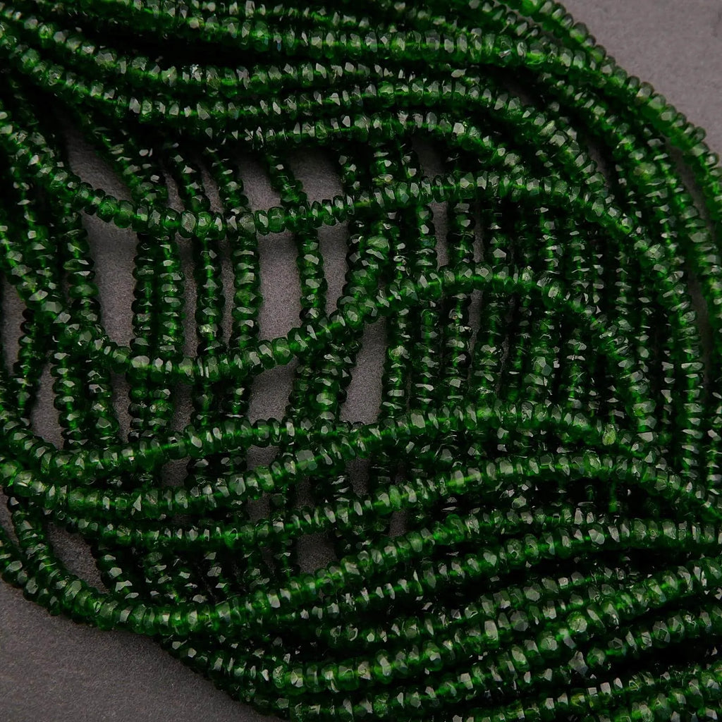 Green beaded necklace on a textured surface