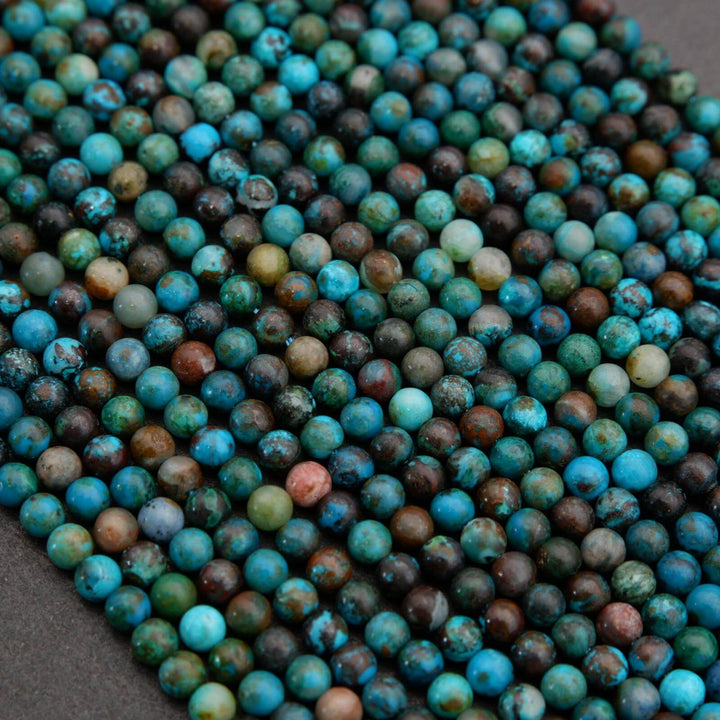 Close-up of multicolored beads on a dark surface