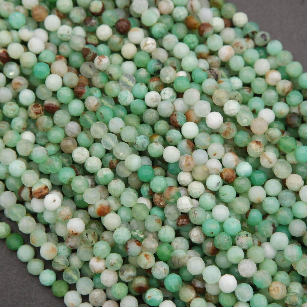 Strands of Chrysoprase beads in mixed green tones, accented by earthy brown and cream patches.