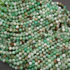 Large bundle of Chrysoprase beads with faceted surfaces, showing a range of mint to deep green hues with natural inclusions.