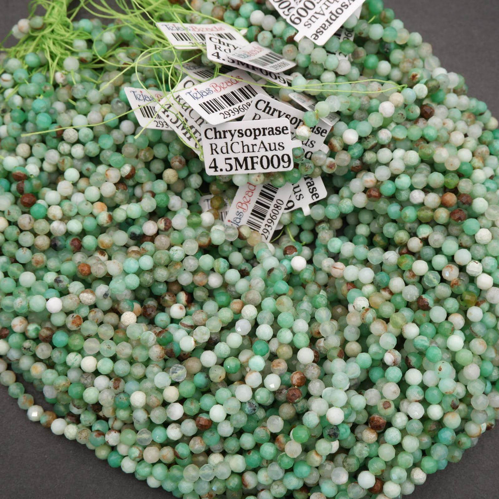 Group of labeled strands of Chrysoprase beads, tied with green string, displaying mixed shades of green and earthy tones.
