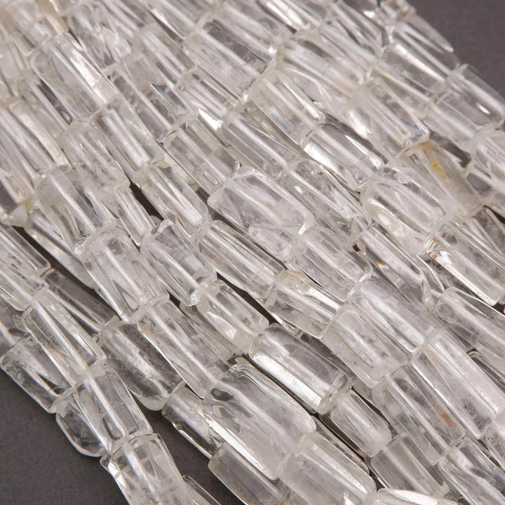 Close-up of clear glass mosaic tiles on a dark background