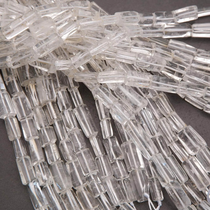 Close-up of clear glass beads on a dark background