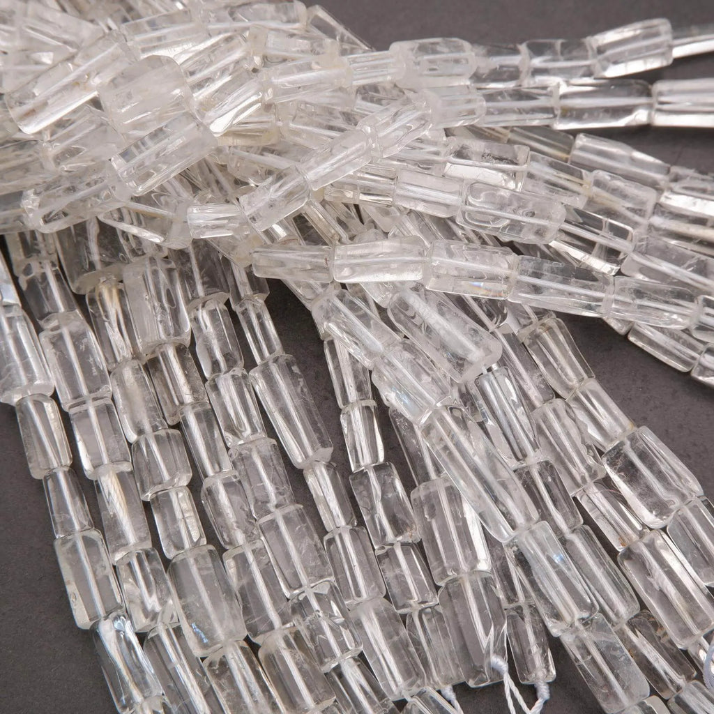 Close-up of clear glass beads on a dark background