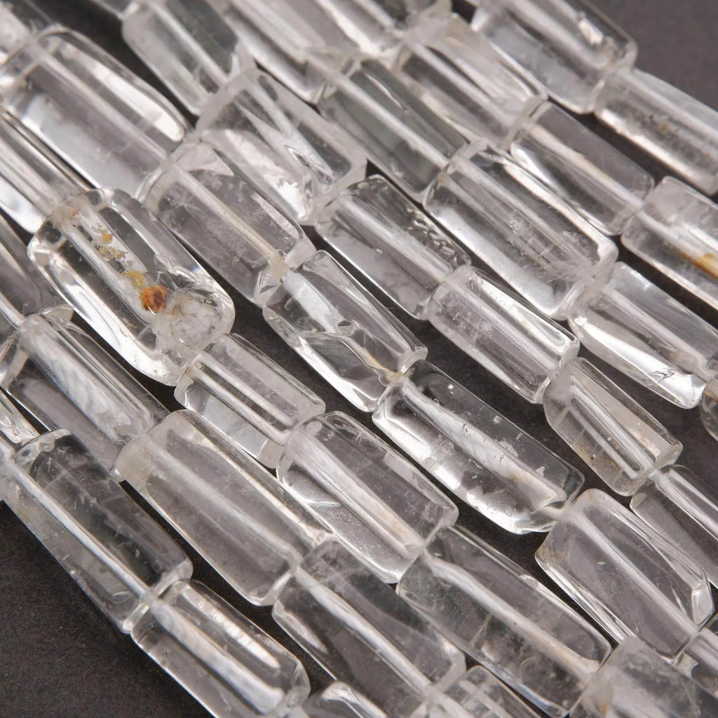 Close-up of clear glass beads on a dark background