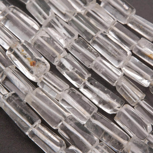 Close-up of clear glass beads on a dark background