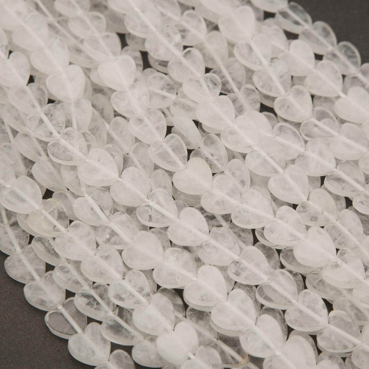 Close-up of clear quartz beads on a dark background
