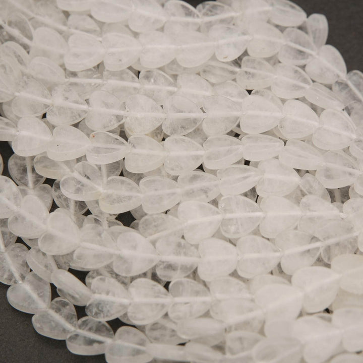 Close-up of stone beads on a dark surface