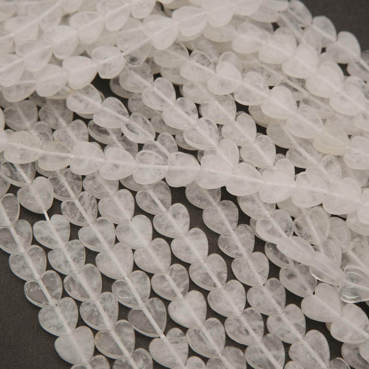 Close-up of clear stone beads on a dark background