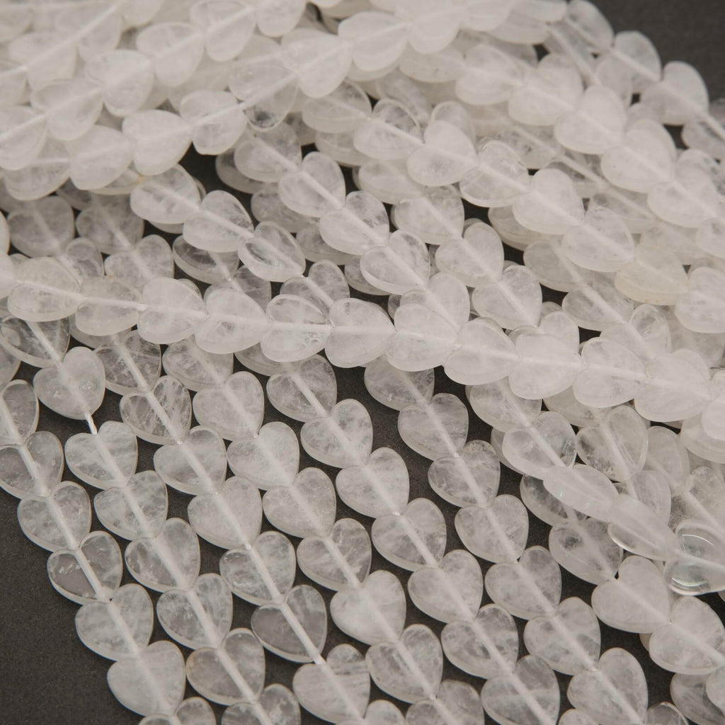 Close-up of clear stone beads on a dark background