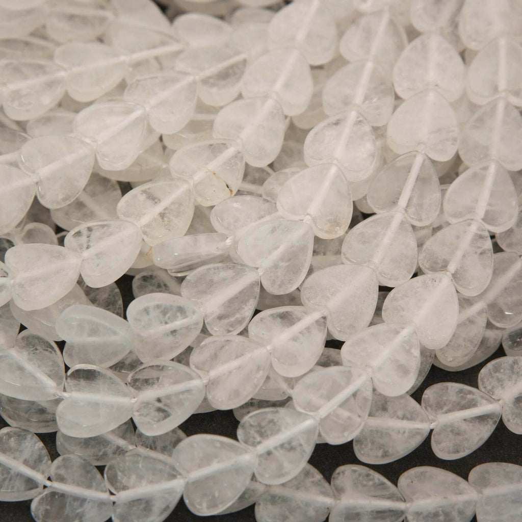 Close-up of clear heart-shaped beads on a dark background