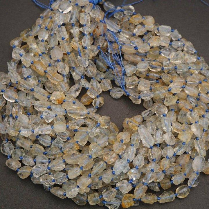 Necklace with clear and amber beads on a dark surface