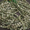 Close-up of green kyanite beads