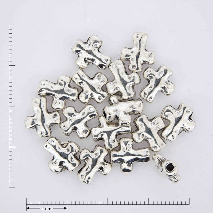 Silver cross findings.
