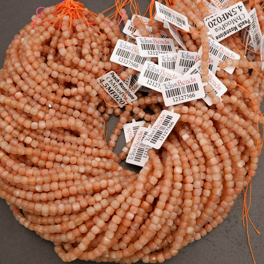 Pile of coral beads with labels on a gray background