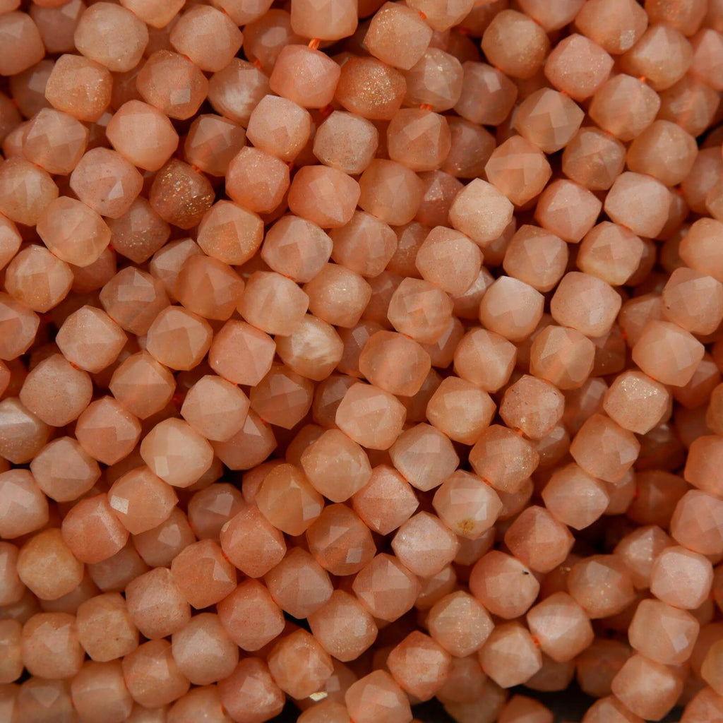 Close-up of small, round, beige-colored beads.