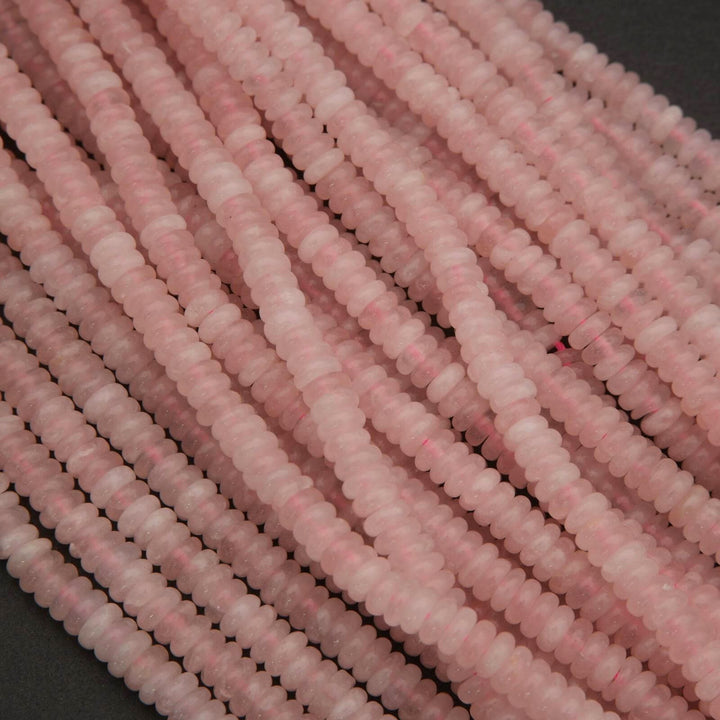 Close-up of pink beads on a dark background