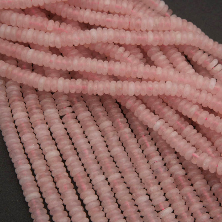 Close-up of pink beads on a dark background