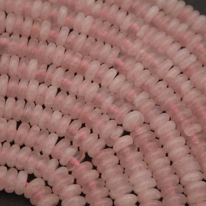 Close-up of pink beads on a dark background