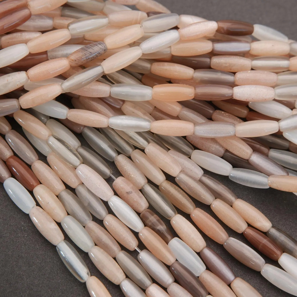 Close-up of multicolored cylindrical beads on a dark background