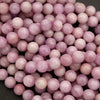 Close-up of pink beads on a dark background