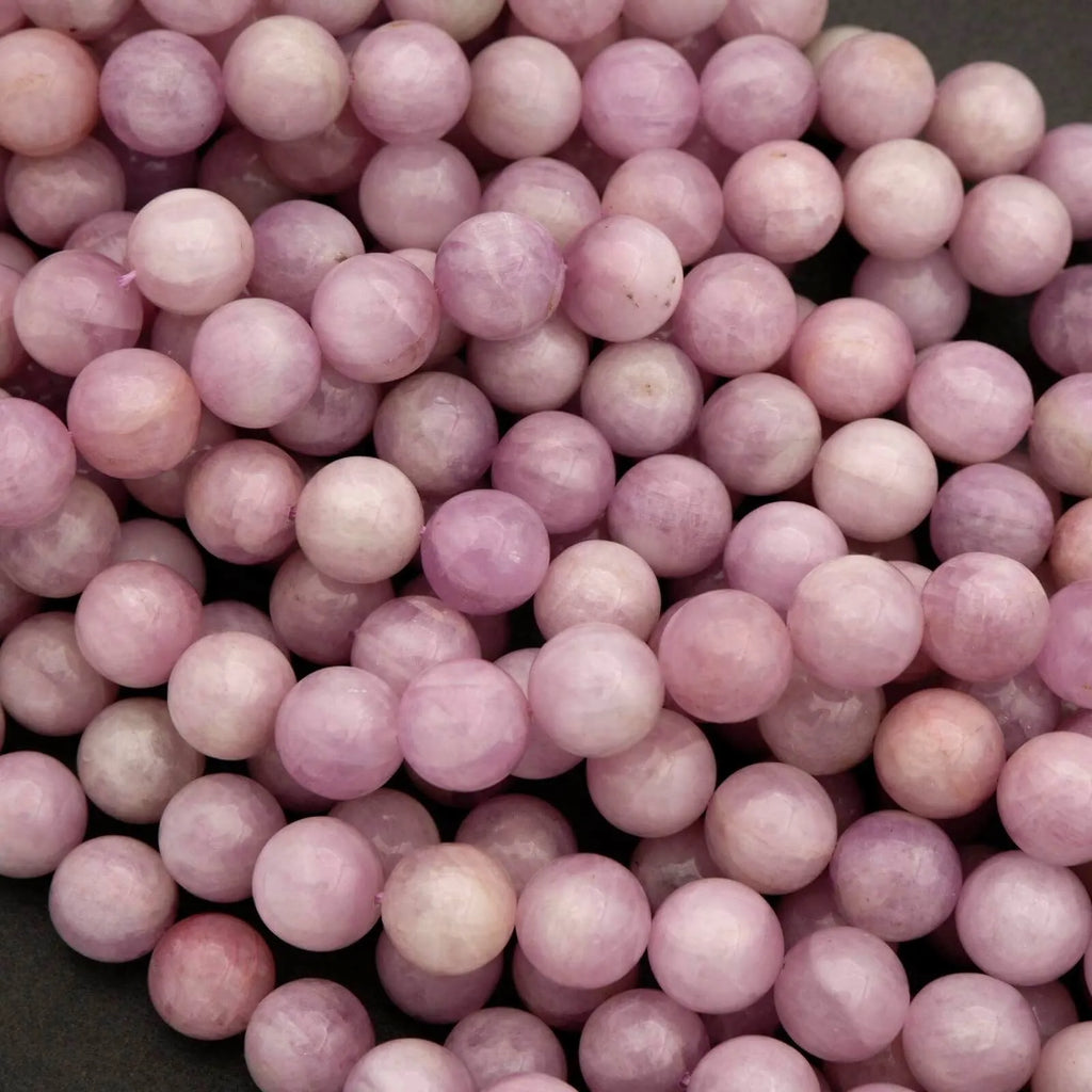 Close-up of pink beads on a dark background