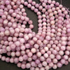 Close-up of pink beads on a dark background