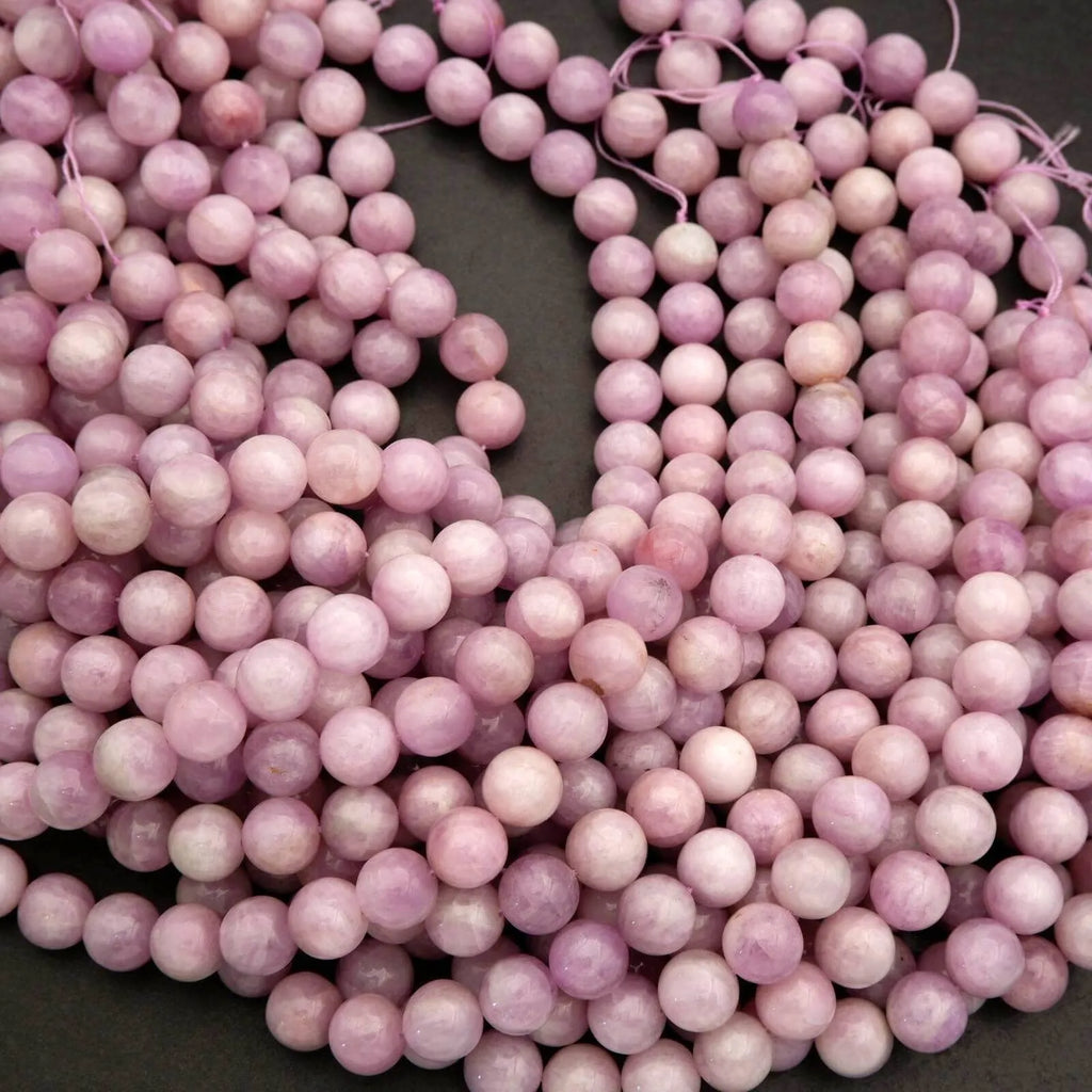 Close-up of pink beads on a dark background