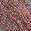 Close-up of multicolored bead strings on a gray background