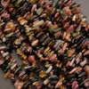 Close-up of multicolored rice grains on a gray background
