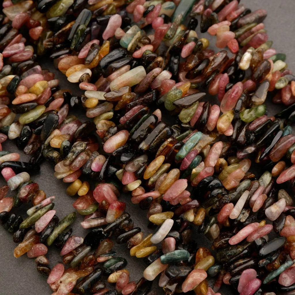 Close-up of multicolored rice grains on a gray background