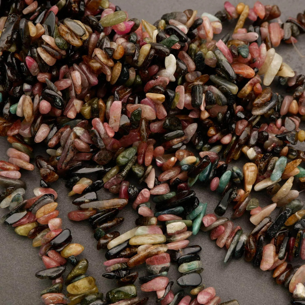 Close-up of a pile of multicolored stones on a dark surface