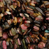Close-up of multicolored stones with a dark background