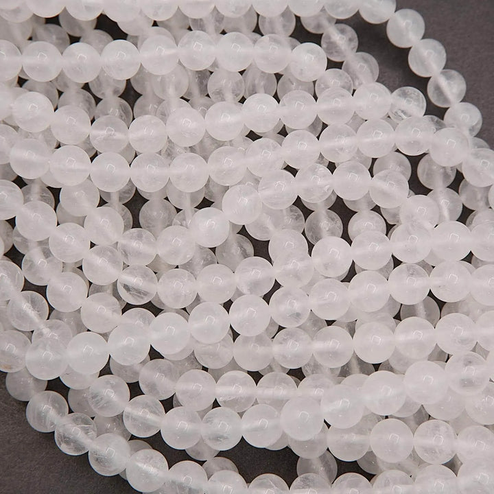 Translucent white quartz beads showing natural internal clouding
