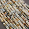 Close-up of multicolored small stones or beads on a gray background