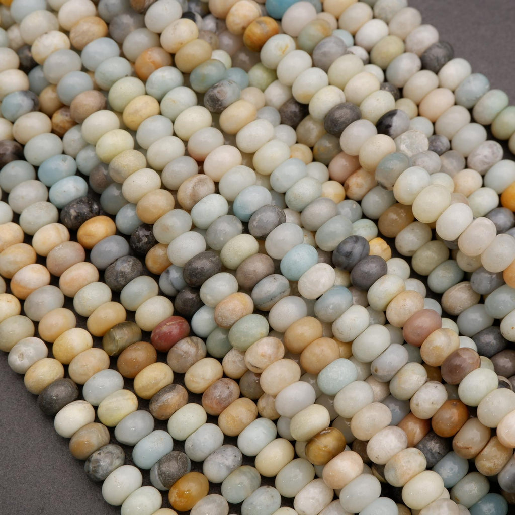 Close-up of multicolored small stones or beads on a gray background