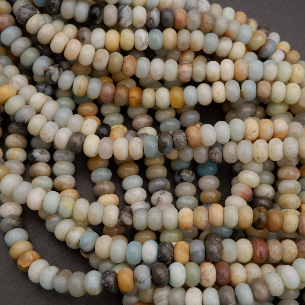 Close-up of a string of multicolored beads on a dark background