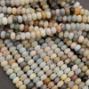 Close-up of multicolored beads in various shades.