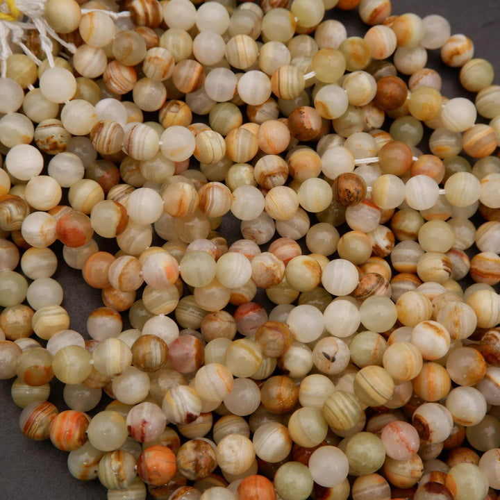 Close-up of multicolored round beads on a dark background