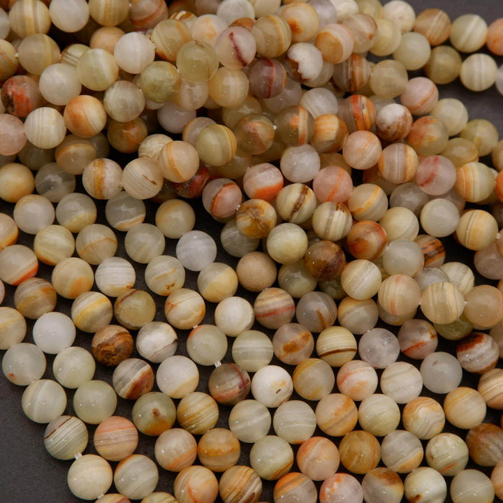 Close-up of multicolored round beads on a dark background