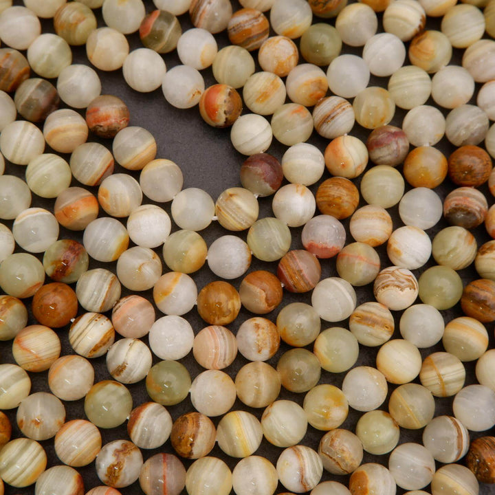 Close-up of multicolored round beads on a dark background