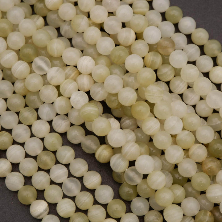 Close-up of light-colored pearls on a dark background