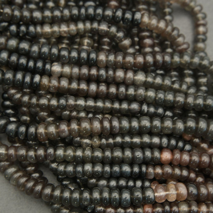 Close-up of metallic beads on a light background