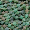 Close-up of green crystal-like beads and stones.