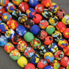 Colorful marbles with abstract patterns on a dark surface